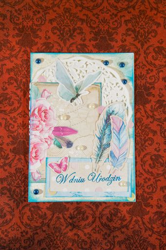 A vertical high angle shot of an amazing handmade post card on a beautiful surface