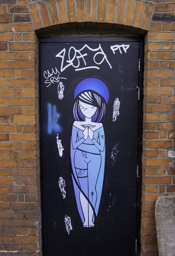 Graffiti art on a door in Camden, London