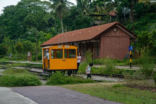 Visitors pose for photos at the historic Bukit Timah Railway Station in Singapore. Horizontal Shot.