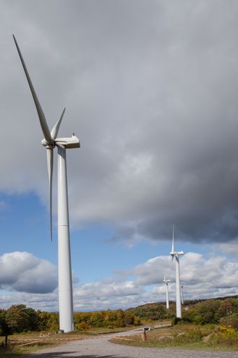 A vertical shot of wind turbines on a cloudy day in Tucker County, West Virginia, USA