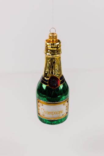 A single hanging Christmas tree bauble in the shape of a green champagne bottle. The background is white.