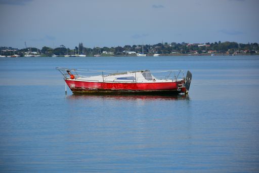 View of smallsail boat moored in Tamaki river