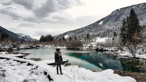 A mesmerizing shot of a young female admiring beautiful winter landscape