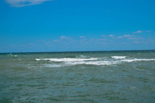 A beautiful view of the tranquil ocean and clear skyline