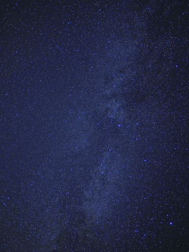 A vertical shot of beautiful sky with stars at night