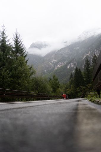 A vertical shot of a road leading down to a mountain in Italy