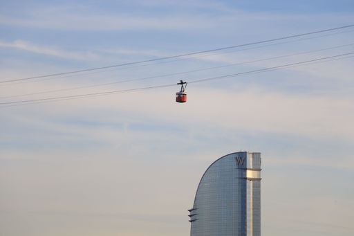 A beautiful shot of a ropeway over the cityscape of Barcelona, Spain