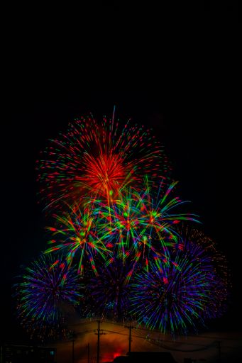 A vertical shot of beautiful colorful fireworks in Daisen City. Akita Prefecture, Japan.