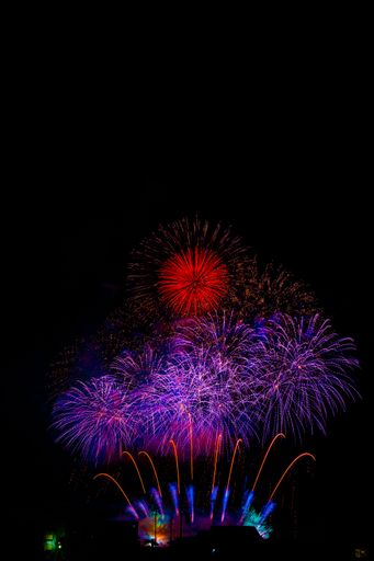 A vertical shot of beautiful colorful fireworks in Daisen City. Akita Prefecture, Japan.