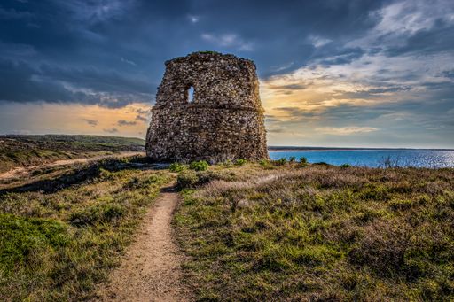A beautiful view of an old building near the sea in Sardegna, Italy