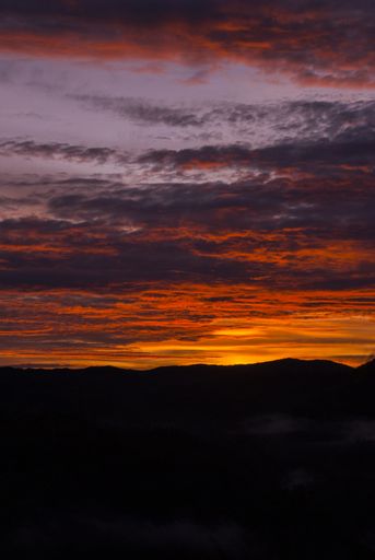 Sunrise clouds and mountains in Guatemala, dramatic sky with striking colors. Tropical area in central america.