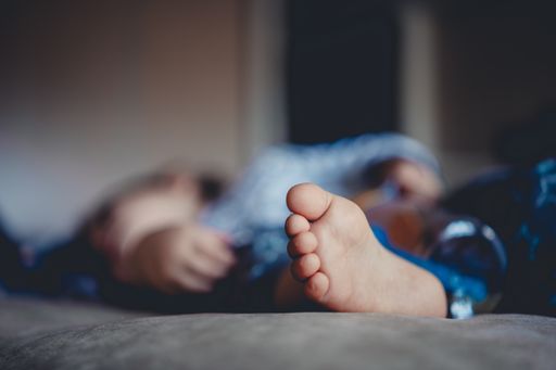 A selective focus shot of baby foot
