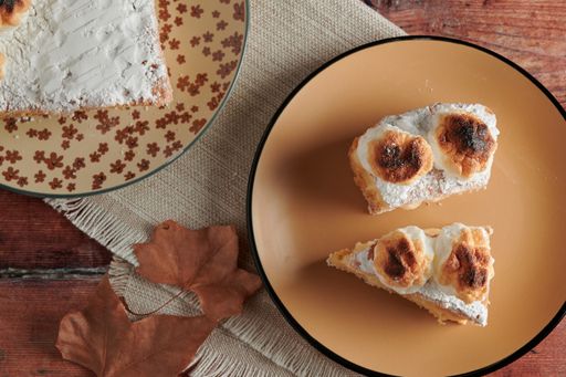 A top view of appetizing pieces of tasty fresh-baked meringue cake with an autumn mood and atmosphere