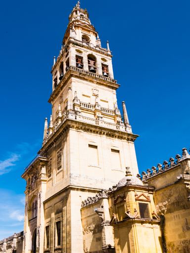 A vertical shot of a tower on the Mosque of Cordoba in Spain