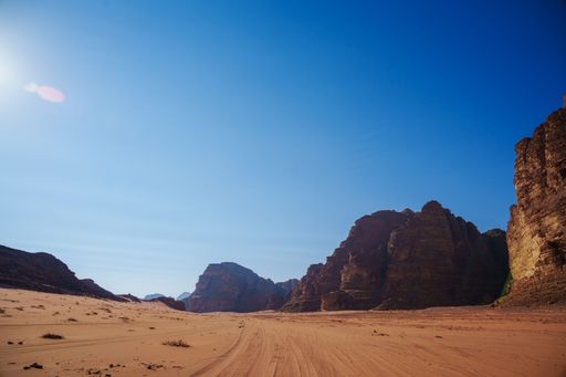 The rock formations in the Wadi Rum desert in Jordan, on a sunny day and blue sky above