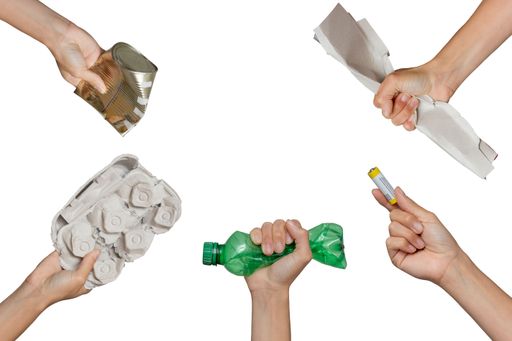 Recycling Garbage and separate Trash. Hand holding waste cardboard, battery, pet, tin on isolated white background.