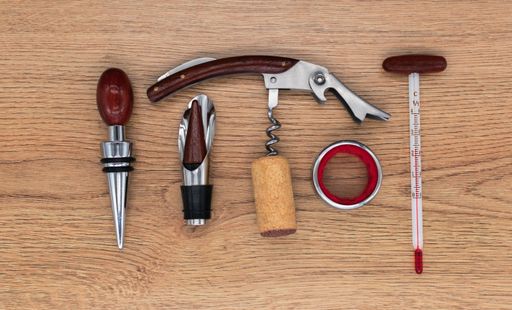 wine utensils kit on a wooden table top