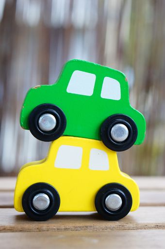 A closeup shot of car toys on a wooden surface
