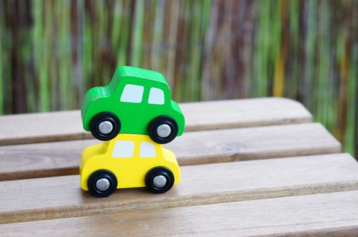 A closeup shot of car toys on a wooden surface