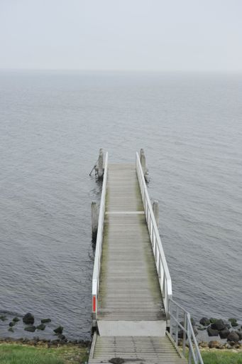 A top view shot an old wooden jetty at a lake