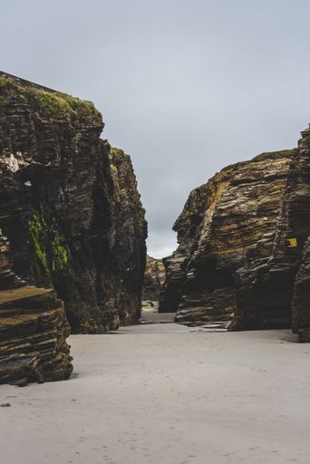 The Beach of the Cathedrals under a cloudy sky during daytime in Spain
