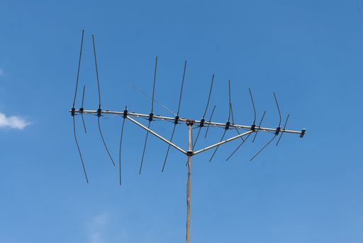 Old tv antenna on roof of house latin america, television technology.