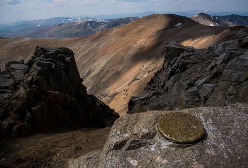 A beautiful scene from top of a mountain for Rocky mountains hiking on Colorado trails with a blue sky
