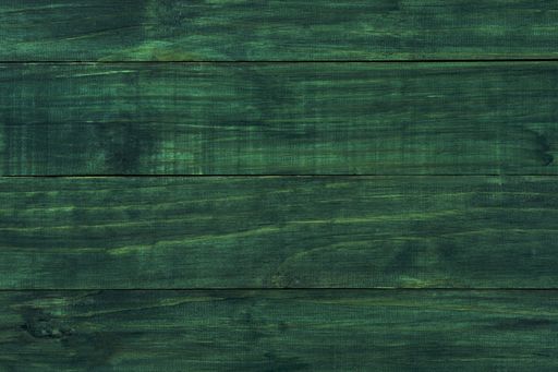 A closeup top view shot of a green wooden parquet decor