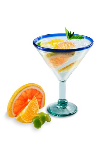 A vertical shot of a citrus cocktail on a white background