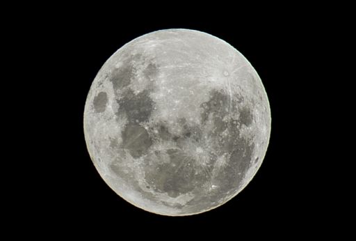 The full moon on a black background - perfect for a wallpaper