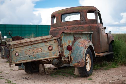 An old abandoned Dodge B Series pickup truck, wrecked