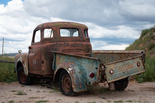 An old abandoned Dodge B Series pickup truck, wrecked