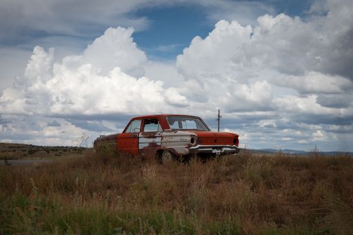 An old first generation Ford Falcon abandoned in the desert