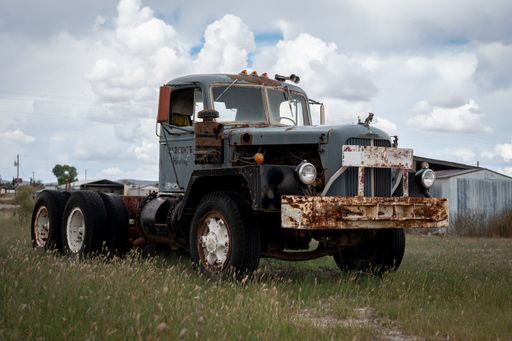 An old Mack truck abandoned in the field