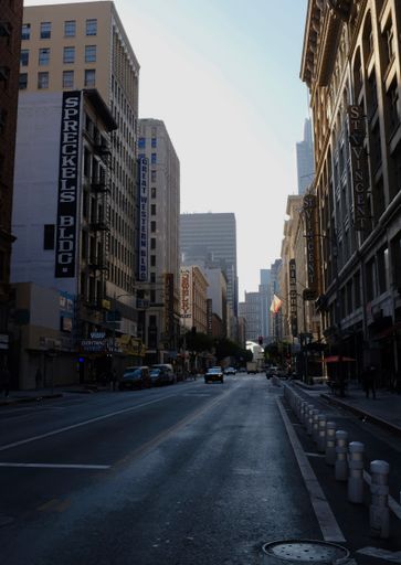 A Vertical shot of a street between buildings, a Jewelry District of Los Angeles