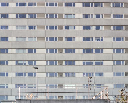 The facade of a residential building with windows