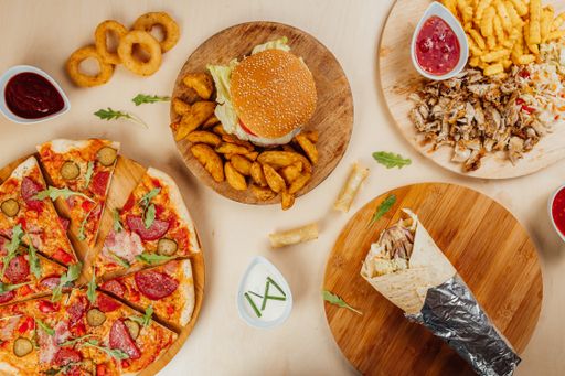 A top view of a gourmet restaurant table with delicious fast foods
