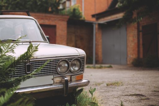 A closeup shot of the front of a car outdoors