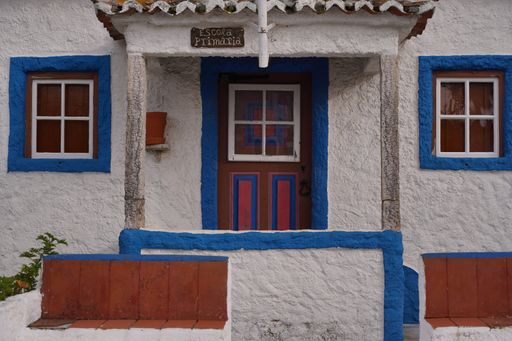 A closeup shot of a rural traditional white-washed building doorway