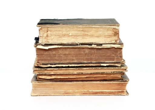 The old and worn-out hardcover books isolated on a white background