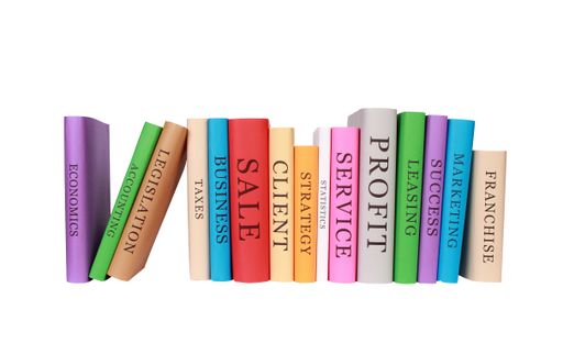 The piles of colorful business books isolated on a white background