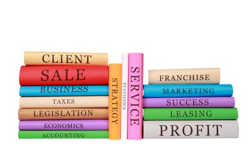 The piles of colorful business books isolated on a white background