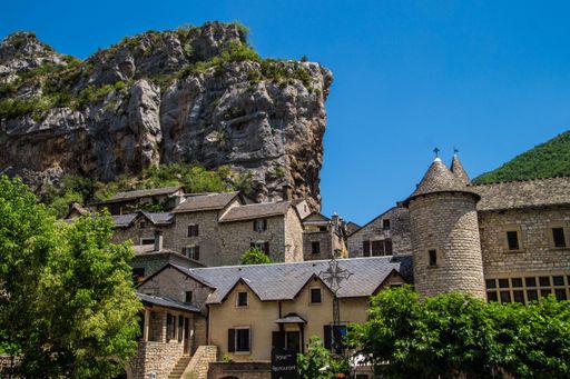 A beautiful shot of old stone houses in green mountains in La Malene, Lozere, France, Europe