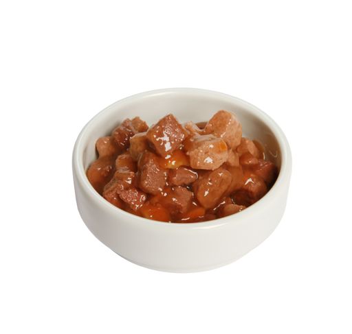 A closeup shot of a white bowl with meat cat food isolated on a white background