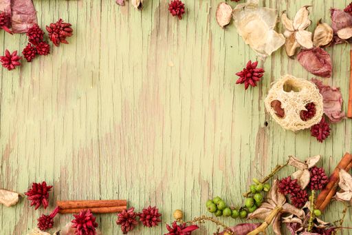 A wooden board with various dried flowers with copy space