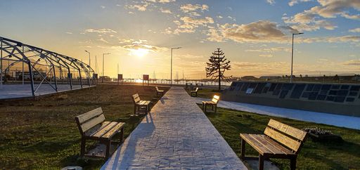 A beautiful shot of a park pathway on a sunset background