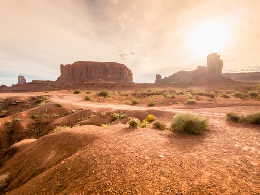 A beautiful view of rocky cliffs under a cloudy sky in Monument Valley, Utah, USA