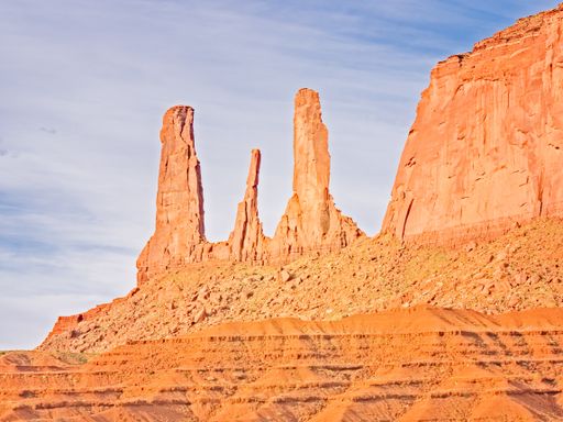 A beautiful view of rocky cliffs under a cloudy sky in Monument Valley, Utah, USA