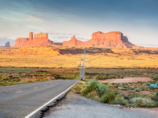 A beautiful view of rocky cliffs under a cloudy sky in Monument Valley, Utah, USA