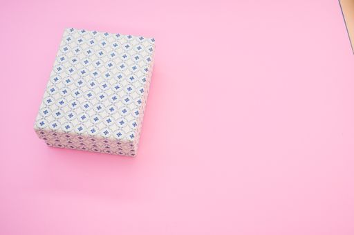 A closeup shot of packaging on a pink background